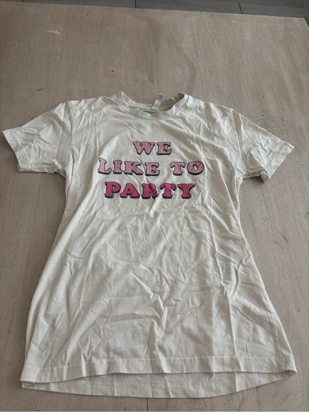 White Graphic Tee "We Like To Party" Pink Lettering